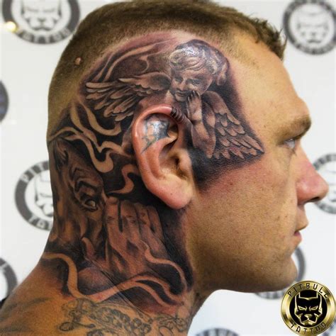 angel whispering in ear neck tattoo|35 Angel Tattoo Designs That Everyone Should Try